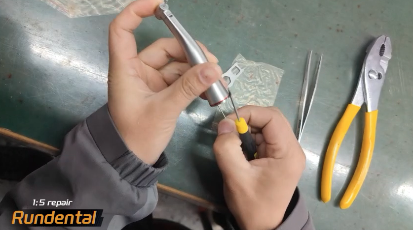 Take the long screws out of it.