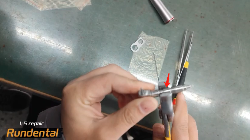 Gently unscrew this part with pliers